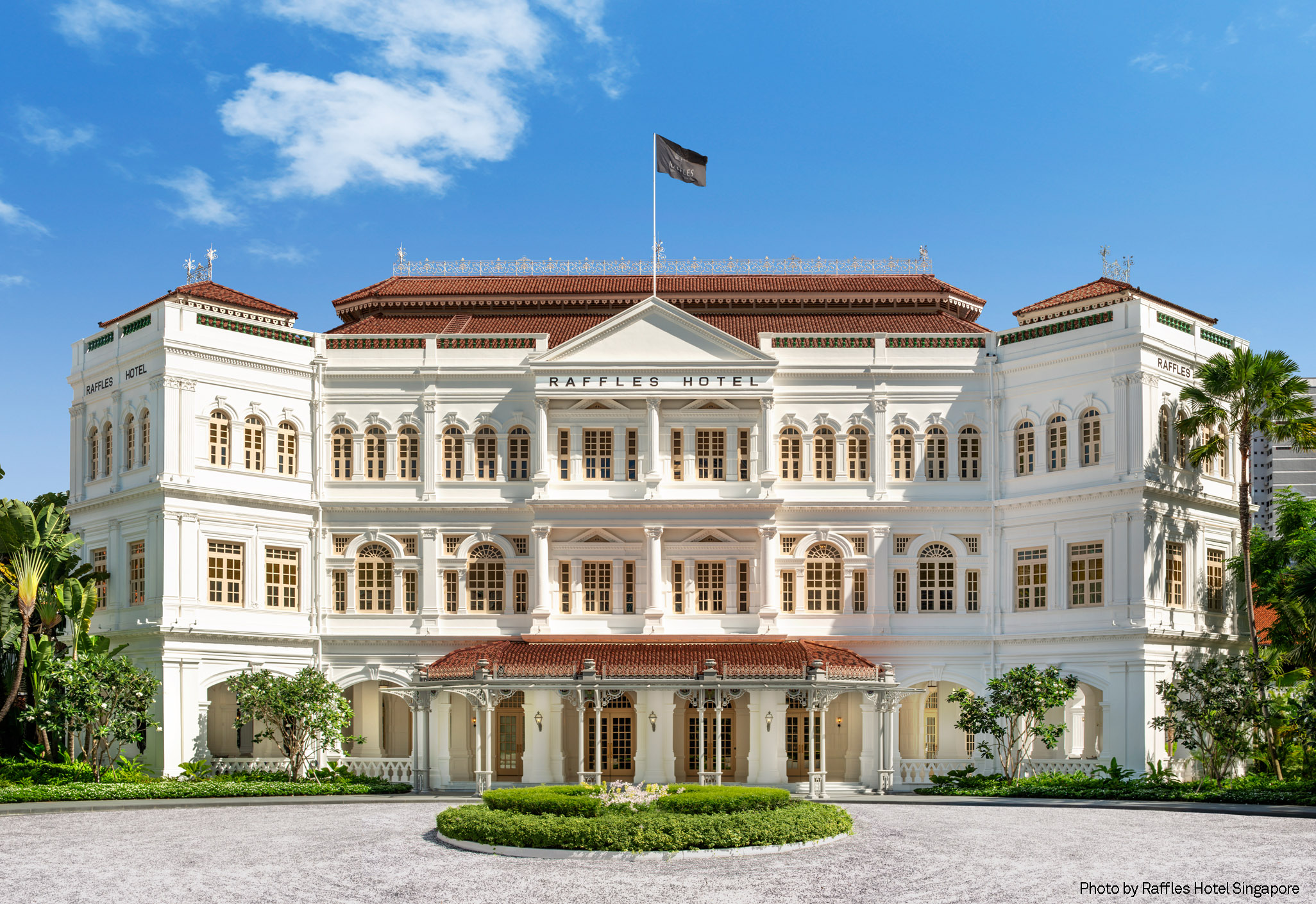 The restored white neo-Renaissance facade of the historic Raffles Hotel Singapore